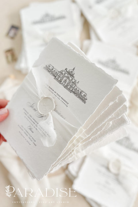 Our handmade wedding invitation suite features a custom hand-drawn illustration of your wedding venue, beautifully printed on luxury cotton paper with deckled edges. Each invitation is finished with a delicate wax seal and minimal fine art typography, creating a design that’s both classic and sophisticated. Soft textures, natural tones, and artisanal craftsmanship make it a perfect fit for estate, destination, or fine art weddings with a refined aesthetic.