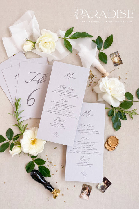 Bring timeless grace to your tablescape with our handcrafted wedding menus printed on soft grey cardstock. Each piece blends fine typography and minimal design, creating a balanced look between sophistication and simplicity. Perfect for romantic, modern, or classic weddings, these menus coordinate beautifully with matching table numbers and stationery for an effortlessly cohesive aesthetic.