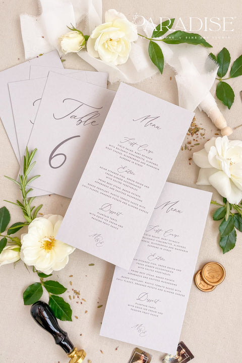 Bring timeless grace to your tablescape with our handcrafted wedding menus printed on soft grey cardstock. Each piece blends fine typography and minimal design, creating a balanced look between sophistication and simplicity. Perfect for romantic, modern, or classic weddings, these menus coordinate beautifully with matching table numbers and stationery for an effortlessly cohesive aesthetic.