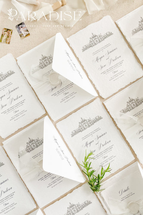 Our handmade wedding invitation suite features a custom hand-drawn illustration of your wedding venue, beautifully printed on luxury cotton paper with deckled edges. Each invitation is finished with a delicate wax seal and minimal fine art typography, creating a design that’s both classic and sophisticated. Soft textures, natural tones, and artisanal craftsmanship make it a perfect fit for estate, destination, or fine art weddings with a refined aesthetic.