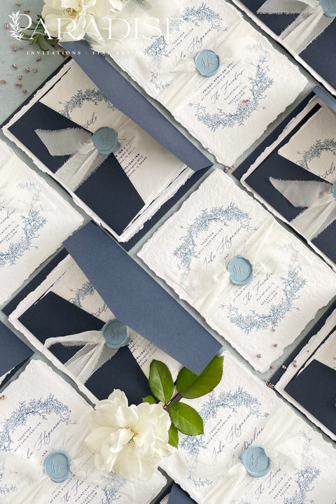 Set a sophisticated and thoughtful tone for your coastal celebration with these unique wedding invites. Perfect for a beach wedding, this suite features a classic navy theme with a beautifully designed wedding timeline to guide your guests through your special day. The elegant calligraphy design adds a touch of classic romance, while the eco-conscious materials ensure your stationery is a beautiful and responsible choice for your special day.