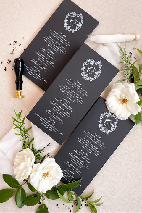 Make a bold and timeless impression with our black and white wedding menus, featuring a refined monogram design and exquisite typography. Crafted on luxury matte cardstock, each piece combines classic elegance with modern minimalism, making it ideal for black-tie weddings, luxury receptions, and sophisticated events. Designed for couples who appreciate fine art stationery, these menus bring harmony, contrast, and elevated refinement to every table setting.