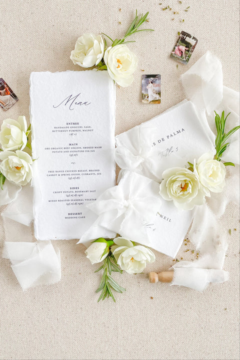 Bring refined elegance to your tablescape with our handmade paper wedding menus, beautifully crafted with deckled edges and minimalist typography. Printed on luxurious cotton paper, each menu adds an artisanal, organic touch to your reception. Perfect for fine-art, coastal, and garden weddings, these menus exude timeless sophistication and natural charm.