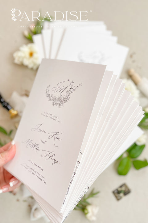 A refined, botanical-inspired wedding program designed for couples who love soft, fine-art elegance. Featuring a delicate floral monogram and graceful script typography, each program is printed on premium cardstock for a polished, timeless presentation. Perfect for romantic garden weddings, classic ceremonies, and celebrations with a natural, airy aesthetic.