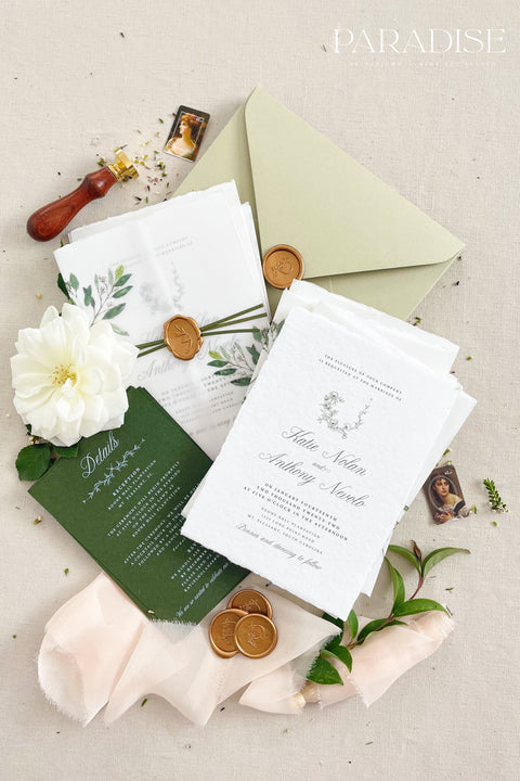 This botanical wedding invitation suite embodies effortless sophistication. Printed on luxury deckled-edge cotton paper, each piece is adorned with a delicate botanical motif and your custom monogram, creating a beautiful balance of refinement and intimacy. Wrapped in a vellum jacket featuring soft greenery details and tied with an olive silk ribbon, this suite exudes quiet romance - the kind inspired by nature, craftsmanship, and heartfelt storytelling.