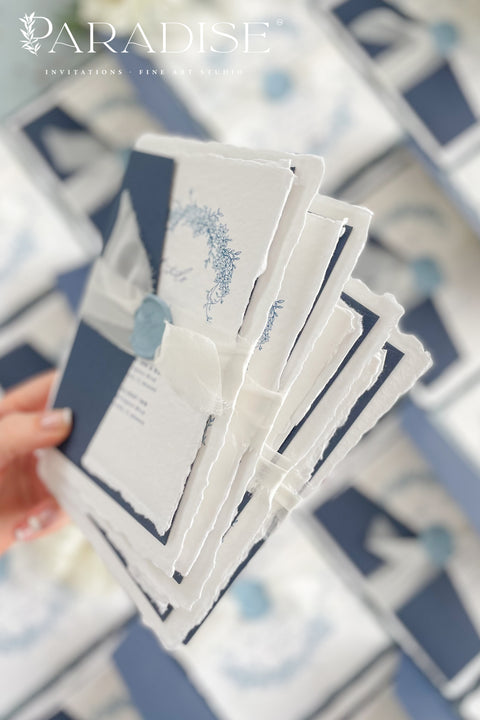 Set a sophisticated and thoughtful tone for your coastal celebration with these unique wedding invites. Perfect for a beach wedding, this suite features a classic navy theme with a beautifully designed wedding timeline to guide your guests through your special day. The elegant calligraphy design adds a touch of classic romance, while the eco-conscious materials ensure your stationery is a beautiful and responsible choice for your special day.