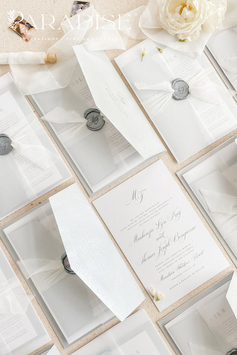 Announce your wedding in timeless style with our minimalist wedding invitations, wrapped in elegant vellum and finished with a silver wax seal. Each invitation is crafted by hand using premium textured paper, refined typography, and fine detailing - perfect for couples who love clean design and understated luxury. Ideal for modern, fine art, destination, or classic weddings.