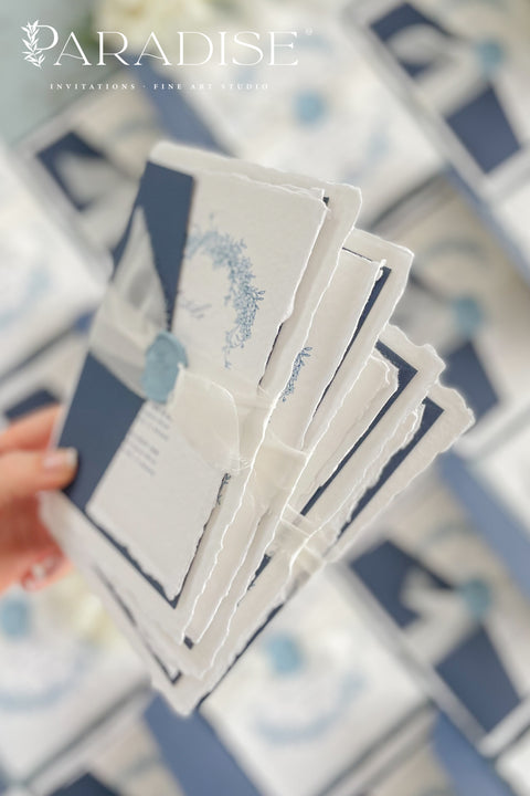 Set a sophisticated and thoughtful tone for your coastal celebration with these unique wedding invites. Perfect for a beach wedding, this suite features a classic navy theme with a beautifully designed wedding timeline to guide your guests through your special day. The elegant calligraphy design adds a touch of classic romance, while the eco-conscious materials ensure your stationery is a beautiful and responsible choice for your special day.