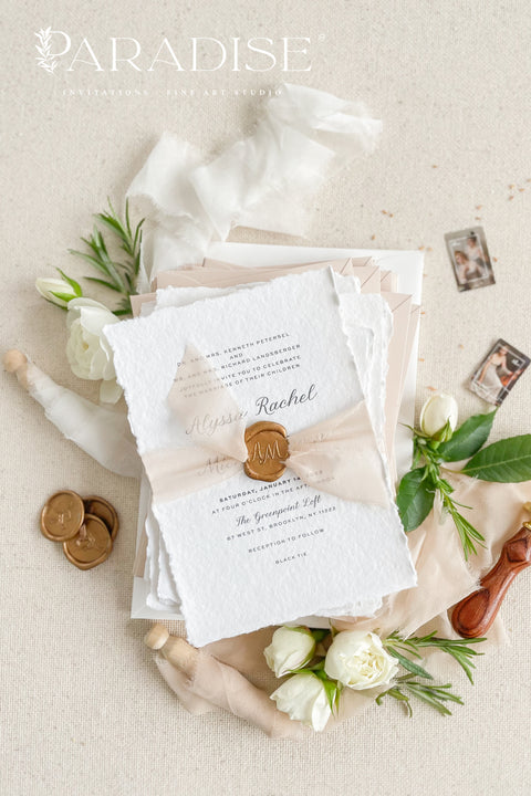 Announce your love story with timeless elegance through our&nbsp;handmade deckled-edge wedding invitations, beautifully detailed with soft blush tones, sheer ribbon, and custom wax seals. Each invitation is carefully crafted by hand using premium cotton paper for a naturally textured, fine art finish that embodies romance and sophistication.