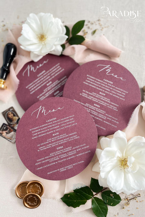 Elevate your reception styling with our burgundy circle wedding menus, designed to blend modern elegance with romantic depth. Printed on luxury matte cardstock in a rich wine shade, these round menus make a stunning statement at each place setting. Their clean, minimalist layout and distinctive shape create a refined aesthetic perfect for autumn soirées, vineyard weddings, or fine-art celebrations.