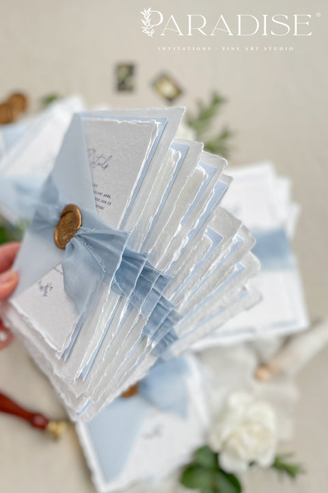 Announce your seaside celebration with these beautifully crafted handmade cotton paper wedding invitations. Perfect for a beach wedding, this suite combines a relaxed, coastal feel with the refined elegance of artisan paper. Each invitation is a true work of fine art, featuring a beautiful deckle edge and a timeless, romantic aesthetic that beautifully sets the tone for your special day.