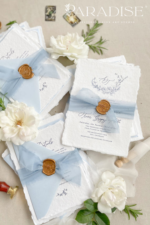 Announce your seaside celebration with these beautifully crafted handmade cotton paper wedding invitations. Perfect for a beach wedding, this suite combines a relaxed, coastal feel with the refined elegance of artisan paper. Each invitation is a true work of fine art, featuring a beautiful deckle edge and a timeless, romantic aesthetic that beautifully sets the tone for your special day.