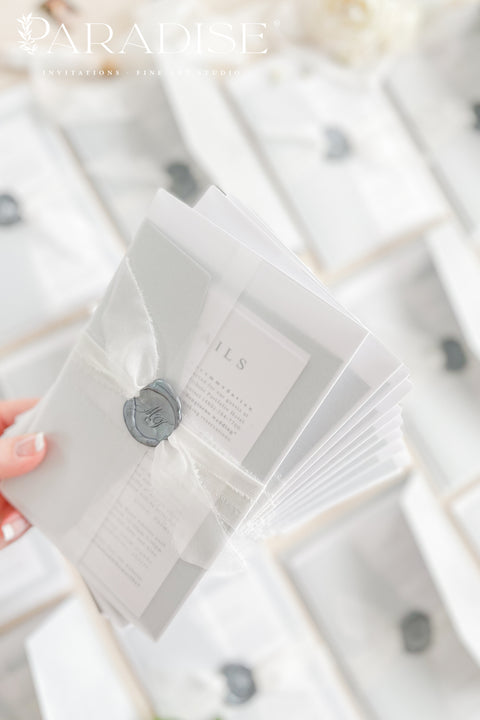 Announce your wedding in timeless style with our minimalist wedding invitations, wrapped in elegant vellum and finished with a silver wax seal. Each invitation is crafted by hand using premium textured paper, refined typography, and fine detailing - perfect for couples who love clean design and understated luxury. Ideal for modern, fine art, destination, or classic weddings.