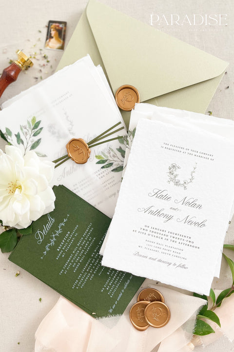 This botanical wedding invitation suite embodies effortless sophistication. Printed on luxury deckled-edge cotton paper, each piece is adorned with a delicate botanical motif and your custom monogram, creating a beautiful balance of refinement and intimacy. Wrapped in a vellum jacket featuring soft greenery details and tied with an olive silk ribbon, this suite exudes quiet romance - the kind inspired by nature, craftsmanship, and heartfelt storytelling.