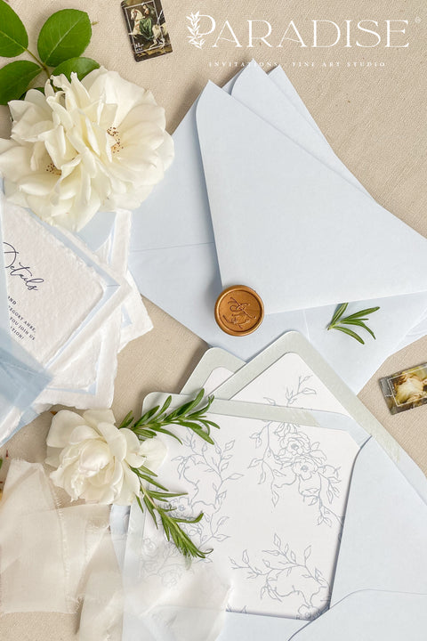 Announce your seaside celebration with these beautifully crafted handmade cotton paper wedding invitations. Perfect for a beach wedding, this suite combines a relaxed, coastal feel with the refined elegance of artisan paper. Each invitation is a true work of fine art, featuring a beautiful deckle edge and a timeless, romantic aesthetic that beautifully sets the tone for your special day.