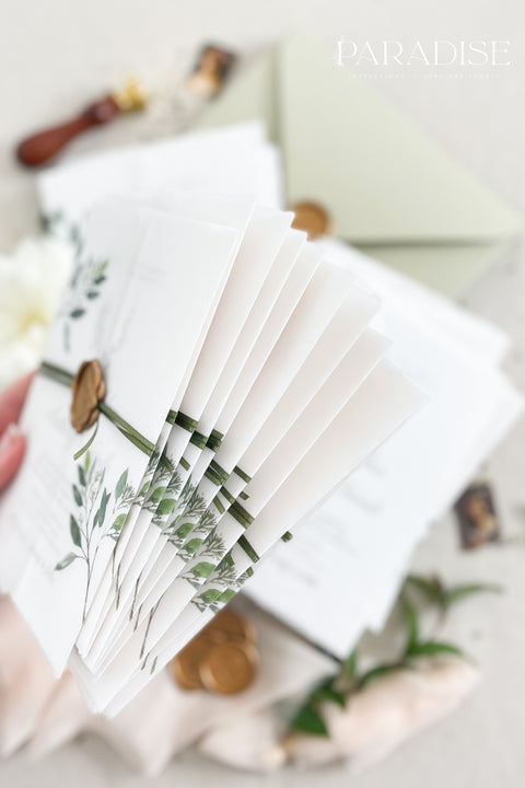 This botanical wedding invitation suite embodies effortless sophistication. Printed on luxury deckled-edge cotton paper, each piece is adorned with a delicate botanical motif and your custom monogram, creating a beautiful balance of refinement and intimacy. Wrapped in a vellum jacket featuring soft greenery details and tied with an olive silk ribbon, this suite exudes quiet romance - the kind inspired by nature, craftsmanship, and heartfelt storytelling.