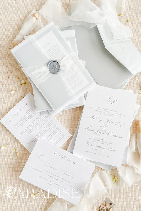 Announce your wedding in timeless style with our minimalist wedding invitations, wrapped in elegant vellum and finished with a silver wax seal. Each invitation is crafted by hand using premium textured paper, refined typography, and fine detailing - perfect for couples who love clean design and understated luxury. Ideal for modern, fine art, destination, or classic weddings.