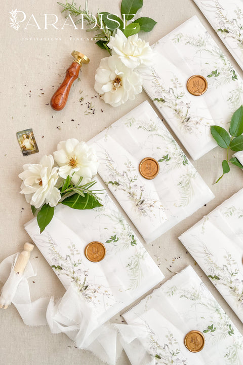 For couples who adore organic beauty and timeless detail, this handmade paper wedding invitation suite captures the essence of fine art stationery. The hand-drawn venue illustration is the centerpiece - a bespoke sketch that celebrates your love story and the place where it begins. Printed on thick, luxury cotton paper, its natural deckled edges and soft texture bring warmth and authenticity to every invitation. Wrapped in a floral vellum jacket and finished with a warm gold wax seal.
