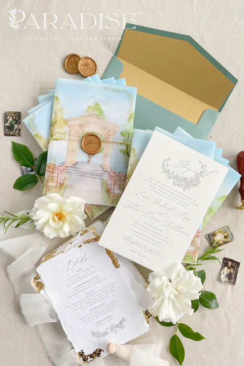 Announce your wedding with timeless artistry through this letterpress wedding invitation suite, featuring a custom watercolor vellum jacket that beautifully captures the romance of your venue. Each invitation is hand-pressed on luxury cotton paper, its deep letterpress impressions paired with soft deckled edges to evoke the elegance of fine art stationery. The suite is wrapped in a vellum overlay adorned with a watercolor venue illustration, sealed with a warm gold wax emblem.