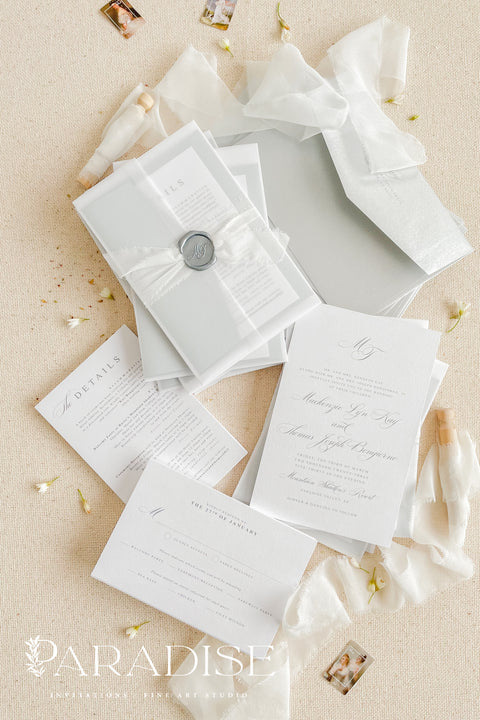 Announce your wedding in timeless style with our minimalist wedding invitations, wrapped in elegant vellum and finished with a silver wax seal. Each invitation is crafted by hand using premium textured paper, refined typography, and fine detailing - perfect for couples who love clean design and understated luxury. Ideal for modern, fine art, destination, or classic weddings.