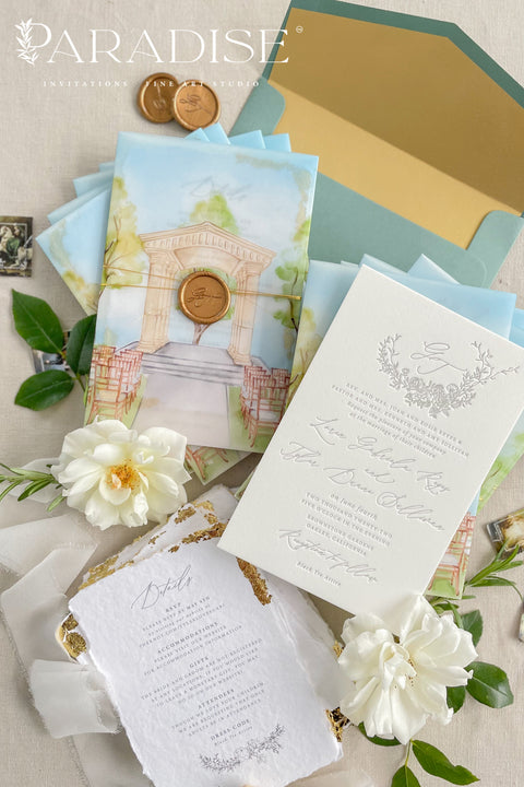 Announce your wedding with timeless artistry through this letterpress wedding invitation suite, featuring a custom watercolor vellum jacket that beautifully captures the romance of your venue. Each invitation is hand-pressed on luxury cotton paper, its deep letterpress impressions paired with soft deckled edges to evoke the elegance of fine art stationery. The suite is wrapped in a vellum overlay adorned with a watercolor venue illustration, sealed with a warm gold wax emblem.