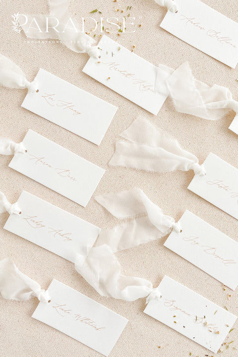 Elevate your seating display with our elegant place cards, designed with clean fine-art typography and finished with soft, hand-tied chiffon ribbon. Crafted for weddings, rehearsal dinners, galas, and intimate celebrations, these name tags add movement, refinement, and a dreamy, romantic touch to your tablescape. Their minimalist design blends effortlessly with modern, classic, and garden-inspired themes, making them a beautiful and versatile choice for any event.