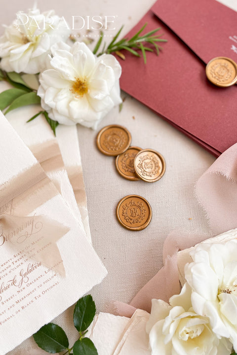 Golden wax seals bring a warm, timeless elegance to your wedding stationery, adding a luxurious finishing touch to envelopes, invitations, and keepsakes. Hand-poured with care, each seal features a rich golden tone that catches the light beautifully, creating a refined detail that feels both classic and romantic. Perfect for weddings, bridal showers, christenings, and fine-art paper suites, these wax seals elevate every piece they adorn.