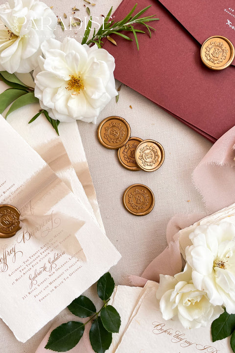 Golden wax seals bring a warm, timeless elegance to your wedding stationery, adding a luxurious finishing touch to envelopes, invitations, and keepsakes. Hand-poured with care, each seal features a rich golden tone that catches the light beautifully, creating a refined detail that feels both classic and romantic. Perfect for weddings, bridal showers, christenings, and fine-art paper suites, these wax seals elevate every piece they adorn.