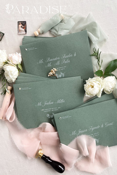Green wedding envelopes with professional address printing, crafted from premium paper and styled to show soft texture, structured quality, and refined typography.