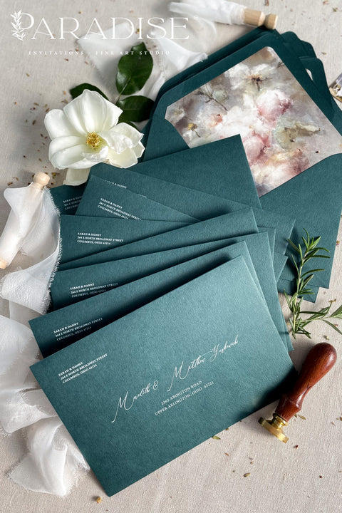 Emerald green wedding envelopes with floral envelope liners, crafted from premium paper and featuring fine art botanical illustrations inside.
