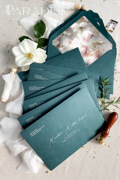 Emerald green wedding envelopes with floral envelope liners, crafted from premium paper and featuring fine art botanical illustrations inside.