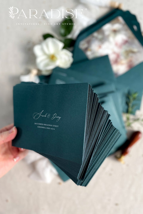 Emerald green wedding envelopes with floral envelope liners, crafted from premium paper and featuring fine art botanical illustrations inside.