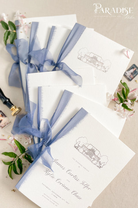 Hand-drawn venue artwork meets fine-art craftsmanship in these beautifully assembled wedding programs. The soft blue ribbon, textured cotton paper, and delicate illustration create an heirloom-quality piece that sets the tone for a romantic, detail-rich ceremony. Each program balances sophistication with warmth, offering guests a meaningful preview of your celebration.