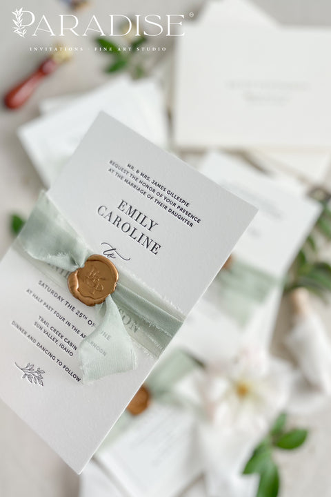 This letterpress wedding invitation suite is designed for couples who value craftsmanship and simplicity. Printed on luxury cotton paper, each invitation showcases the unmistakable texture and depth of traditional letterpress printing, where every word is gently pressed into the paper for a tactile, heirloom finish. Wrapped in a sage green silk ribbon and sealed with hand-poured gold wax, this suite exudes quiet luxury and romance.
