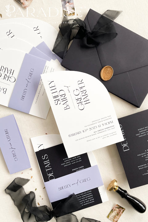 Contemporary, bold, and beautifully refined - our half arched wedding invitation suite is the perfect choice for couples who adore modern minimalism with an editorial twist. Crafted with precision on luxury matte cardstock, each suite pairs black and white invitations with lavender details, arched silhouettes, and a black chiffon ribbon tied in a soft bow. The combination of elegant typography and structural design creates a clean, modern aesthetic ideal for urban, modern-romantic, or black-tie weddings.