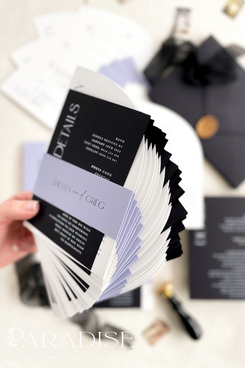 Contemporary, bold, and beautifully refined - our half arched wedding invitation suite is the perfect choice for couples who adore modern minimalism with an editorial twist. Crafted with precision on luxury matte cardstock, each suite pairs black and white invitations with lavender details, arched silhouettes, and a black chiffon ribbon tied in a soft bow. The combination of elegant typography and structural design creates a clean, modern aesthetic ideal for urban, modern-romantic, or black-tie weddings.