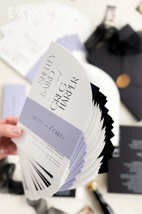 Contemporary, bold, and beautifully refined - our half arched wedding invitation suite is the perfect choice for couples who adore modern minimalism with an editorial twist. Crafted with precision on luxury matte cardstock, each suite pairs black and white invitations with lavender details, arched silhouettes, and a black chiffon ribbon tied in a soft bow. The combination of elegant typography and structural design creates a clean, modern aesthetic ideal for urban, modern-romantic, or black-tie weddings.