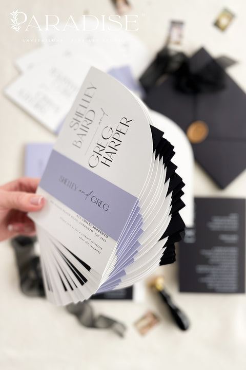 Contemporary, bold, and beautifully refined - our half arched wedding invitation suite is the perfect choice for couples who adore modern minimalism with an editorial twist. Crafted with precision on luxury matte cardstock, each suite pairs black and white invitations with lavender details, arched silhouettes, and a black chiffon ribbon tied in a soft bow. The combination of elegant typography and structural design creates a clean, modern aesthetic ideal for urban, modern-romantic, or black-tie weddings.