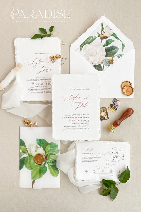 Announce your wedding with refined botanical charm through this handmade paper wedding invitation suite, adorned with vellum wraps featuring watercolor botanical artwork and a custom hand-drawn map that beautifully tells your story. Each invitation is printed on luxury deckled-edge cotton paper, offering a soft, organic texture that captures the essence of fine art craftsmanship. The botanical vellum jacket adds a touch of delicate transparency.
