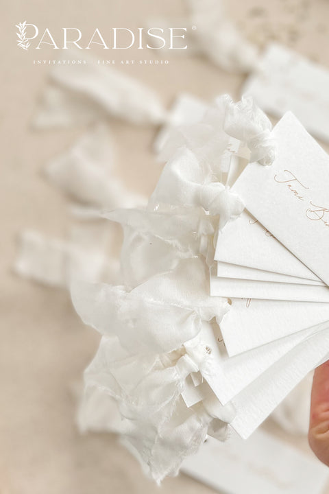 Elevate your seating display with our elegant place cards, designed with clean fine-art typography and finished with soft, hand-tied chiffon ribbon. Crafted for weddings, rehearsal dinners, galas, and intimate celebrations, these name tags add movement, refinement, and a dreamy, romantic touch to your tablescape. Their minimalist design blends effortlessly with modern, classic, and garden-inspired themes, making them a beautiful and versatile choice for any event.
