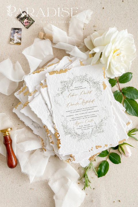 Announce your summer celebration with the perfect blend of bohemian charm and elegant sophistication with these exquisite wedding invitations. The unique wreath design adds a touch of natural beauty, while the delicate golden leaf detail provides a subtle, luxurious shimmer. This boho chic stationery is perfect for a laid-back, romantic summer wedding, setting a warm and inviting tone for your guests.