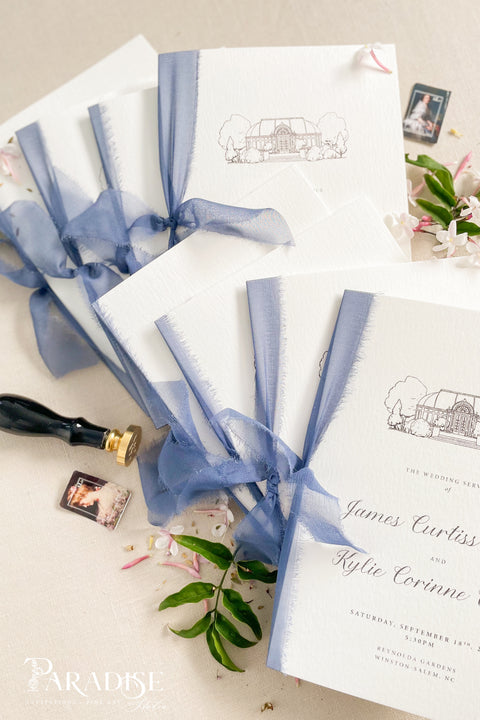 Hand-drawn venue artwork meets fine-art craftsmanship in these beautifully assembled wedding programs. The soft blue ribbon, textured cotton paper, and delicate illustration create an heirloom-quality piece that sets the tone for a romantic, detail-rich ceremony. Each program balances sophistication with warmth, offering guests a meaningful preview of your celebration.