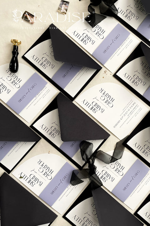 Contemporary, bold, and beautifully refined - our half arched wedding invitation suite is the perfect choice for couples who adore modern minimalism with an editorial twist. Crafted with precision on luxury matte cardstock, each suite pairs black and white invitations with lavender details, arched silhouettes, and a black chiffon ribbon tied in a soft bow. The combination of elegant typography and structural design creates a clean, modern aesthetic ideal for urban, modern-romantic, or black-tie weddings.