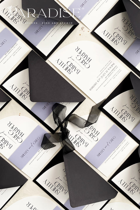Contemporary, bold, and beautifully refined - our half arched wedding invitation suite is the perfect choice for couples who adore modern minimalism with an editorial twist. Crafted with precision on luxury matte cardstock, each suite pairs black and white invitations with lavender details, arched silhouettes, and a black chiffon ribbon tied in a soft bow. The combination of elegant typography and structural design creates a clean, modern aesthetic ideal for urban, modern-romantic, or black-tie weddings.