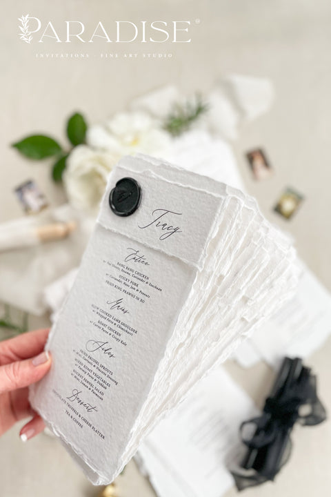 Add a touch of timeless sophistication to your wedding table with our handmade paper menus, sealed with a luxurious black wax emblem. Crafted on deckled-edge cotton rag paper, these menus embody fine art elegance and artisanal craftsmanship - a perfect balance of simplicity and grandeur. Ideal for romantic, modern, or classic weddings, each menu is hand-finished for a refined aesthetic that leaves a lasting impression on your guests.