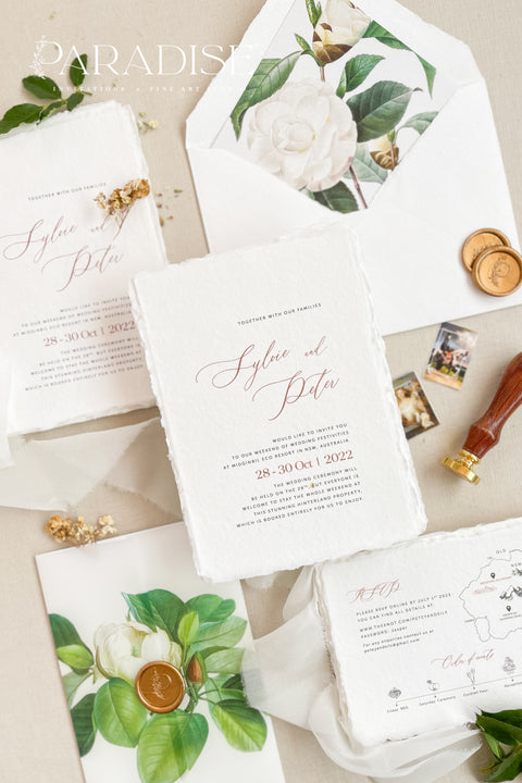 Announce your wedding with refined botanical charm through this handmade paper wedding invitation suite, adorned with vellum wraps featuring watercolor botanical artwork and a custom hand-drawn map that beautifully tells your story. Each invitation is printed on luxury deckled-edge cotton paper, offering a soft, organic texture that captures the essence of fine art craftsmanship. The botanical vellum jacket adds a touch of delicate transparency.
