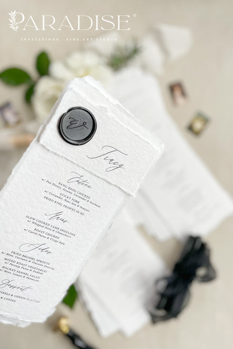 Add a touch of timeless sophistication to your wedding table with our handmade paper menus, sealed with a luxurious black wax emblem. Crafted on deckled-edge cotton rag paper, these menus embody fine art elegance and artisanal craftsmanship - a perfect balance of simplicity and grandeur. Ideal for romantic, modern, or classic weddings, each menu is hand-finished for a refined aesthetic that leaves a lasting impression on your guests.