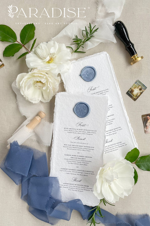 Elevate your table styling with our handmade paper wedding menus, featuring deckled edges, soft texture, and artisanal craftsmanship. Each menu is printed on 100% cotton rag paper, adorned with a wax seal in custom color, and designed to perfectly complement fine art or romantic wedding themes. These menus embody elegance, authenticity, and natural charm, making them a statement piece for your celebration.
