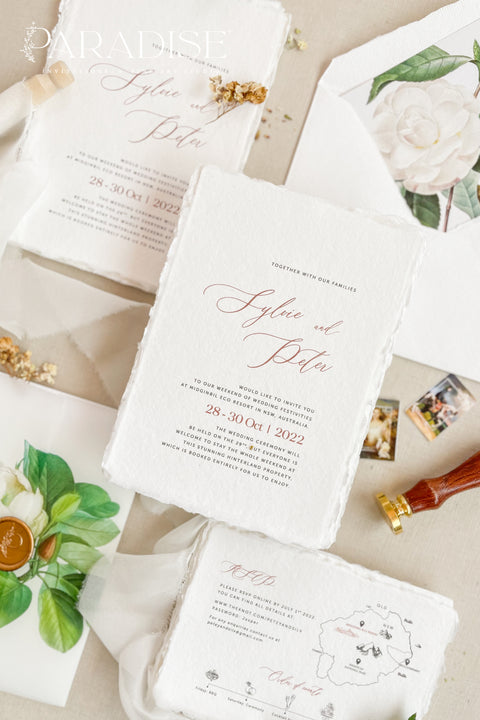 Announce your wedding with refined botanical charm through this handmade paper wedding invitation suite, adorned with vellum wraps featuring watercolor botanical artwork and a custom hand-drawn map that beautifully tells your story. Each invitation is printed on luxury deckled-edge cotton paper, offering a soft, organic texture that captures the essence of fine art craftsmanship. The botanical vellum jacket adds a touch of delicate transparency.