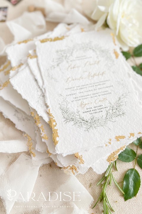 Announce your summer celebration with the perfect blend of bohemian charm and elegant sophistication with these exquisite wedding invitations. The unique wreath design adds a touch of natural beauty, while the delicate golden leaf detail provides a subtle, luxurious shimmer. This boho chic stationery is perfect for a laid-back, romantic summer wedding, setting a warm and inviting tone for your guests.